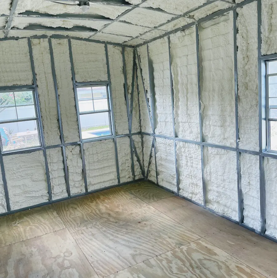 Closed-cell spray foam insulation applied to wall cavities in a residential project in Whispering Pines